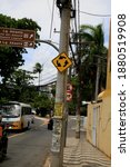 Small photo of salvador, bahia, brazil - december 21, 2020: traffic sign indicating rotatory is seen attached to a pole in the neighborhood of Itapua, in the city of Salvador.
