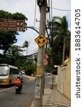 Small photo of salvador, bahia, brazil - december 21, 2020: traffic sign indicating rotatory is seen attached to a pole in the neighborhood of Itapua, in the city of Salvador.