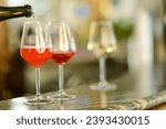 Small photo of Young female bartender wearing face mask pouring sparkling prose