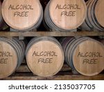Barrels in cellar with text alcohol free.