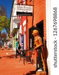 Small photo of Fredericksburg, VA, USA March 29, 2012 A controversial cigar store Indian stands outside of a tobacconist's shop in Fredericksburg, Virginia. Similar objects are said to promote bad stereotypes.