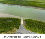 Small photo of Overhead drone view of boat launch ramp and jetty on Proserpine River at Conway Beach, Queensland, Australia