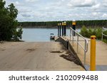 Small photo of Airlie Beach, queensland, Australia - January 2022: A fisherman returns in his boat to the loading ramp and jetty on Proserpine River