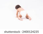 Small photo of Cute asian baby toddler crawling on floor to learn to crawl with isolated on white background Adorable baby keeping her hands and legs put on the floor to crawl fun and happiness Toddler wear diapers