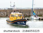 Small photo of LOWESTOFT, SUFFOLK, UK - JULY 30, 2022: Shannon-class lifeboat 13-05 RNLB Patsy Knight, the latest class to serve the shores of the British Isles, sets out during the International Smack Race Festival