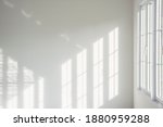 White room, glass windows, combined with the sunlight on the wall.