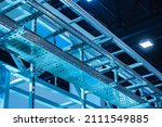Small photo of Suspended trays for electrical communication. Perforated trays of metal. Construction for laying wires and utilities. Place for electrical wires under hangar roof. Concept installation of utilities