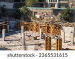 Small photo of Construction underground floor building. Foundation house with metal fittings. construction underground parking. Erection house with minus first floor. Installation supports during construction