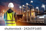 Small photo of Man works at factory. Industrialist back to camera. Factory worker with laptop. Night plant behind engineer. Manufacturing plant in evening. Man production specialist. Inspector inspects manufactory