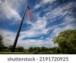 Small photo of Sheboygan, Wisconsin, USA - July 19, 2022: The Acuity Flagpole stands 400 feet tall and flies a 9,800 square foot flag weighing 250 pounds with stripes five feet high and stars over three feet wide.