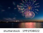 Fireworks display over Zachs Bay at Jones Beach State Park, celebrating essential workers and the state vaccination rate. Long Island New York