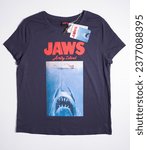 Small photo of kent, uk, 01.012023 Jaws amity island, genuine universal studios jaws t shirt. Film and movie merchandise. famous iconic shark movie.