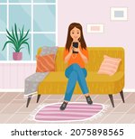 lady sitting on couch at home ...
