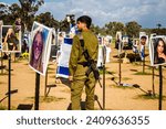 Small photo of Re'im, Israel – January 5, 2024 Israeli soldiers come to pay tribute to those who were killed during the terrorist attack against the NOVA festival which took place on October 7, 2023