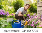 Small photo of Gardening and agriculture concept. Young woman farm worker gardening flowers in garden. Gardener planting flowers for bouquet. Summer gardening work. Girl gardening at home in backyard