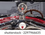 Small photo of Sparkford.Somerset.United Kingdom.March 26th 2023.Close up of the badge and bonnet ornament on a 1928 Jordan Playboy Special at the Haynes Motor Museum in Someset