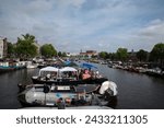 Small photo of Boats Lying On The Amstel Rive Awaiting For The Gaypride At Amsterdam The Netherlands 5-8-2023