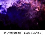 Thickpink and purple smoke on a black isolated background. Background from the smoke of vape