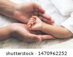 Baby's hand Placed on the mother's hand, concept to showing love and concern for her children, And is love family relationship.