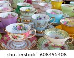 Pretty pastel tea cups in row   ...