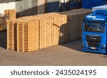 Small photo of Thine valley, Germany - September 25, 2022: Rows of pallets and the truck at the factory