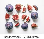 Fresh figs. Food Photo. Creative scheme of the whole and sliced figs on a white background, inscribed in a rectangle. View from above. Copy space