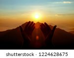 two hands of muslim who praying for hope and successful in sunrise. Use for Al-quran Quote background 