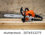 Small photo of Zhytomyr, Ukraine, on October 17, 2021. Lightweight Stihl MS 180 chainsaw for household use.