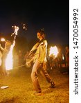 Small photo of Springville, IN – August 2, 2019: Fire dancer juggalo at the 20th annual Gathering of the Juggalos in Springville, Indiana