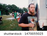Small photo of Springville, IN – August 2, 2019: Juggalo eating a meat stick at the 20th annual Gathering of the Juggalos in Springville, Indiana