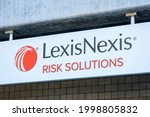 Small photo of LexisNexis Risk Solution sign and logo advertise company that provide computer-assisted legal research and business research and risk management - San Jose, California, USA - 2021