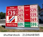 Small photo of Gas station price sign. The average gasoline price in California exceeded 5 dollars per gallon - San Jose, California, USA - March 11, 2022