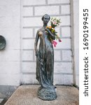 Small photo of Munich/Germany - January 23,2020 - Juliet Capulet Statue with pine branch in Munich, Germany.