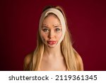 Luxurious woman and plastic surgery moment. Exaggerated injection to the lips of a beautiful blonde