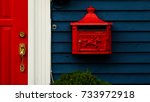 A Bright Red Metal Mailbox Or...