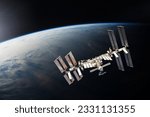 ISS over the planet Earth. Elements of this image furnished by NASA.