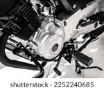 motor of brand new cross-country enduro motorcycle, black white, closeup