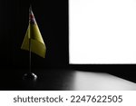 Small photo of Small national flag of the Niue on a black background.