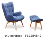 Blue, cornflower, dark blue color armchair and small chair for legs. Modern designer armchair on white background. Textile armchair and chair. Series of furniture.