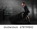 crossfit training - man flipping tire