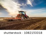 Tractor Cultivating Field At...