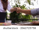 Small photo of The young businesswoman shook hands with legal advisers after drawing up a contract for investors to sign and to ensure legitimacy. Business idea with a legal advisor to consult for accuracy.