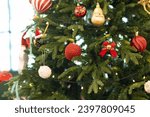 Small photo of The Christmas tree is decorated with small toys and balls to brighten up the Christmas season and the Christmas tree is always green in every season. It represents the eternity of the Lord Jesus.