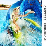 Child On Water Slide At...