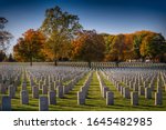 headstones are perfectly aligned  at the Dayton Nation Cemetery in Dayton, Ohio during the colorful Autumn season.