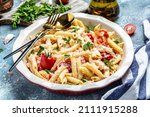 Small photo of Trend Feta pasta recipe made of cherry tomatoes, feta cheese, garlic and herbs. cooking recipe ingredients, place for text, top view