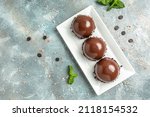 Small photo of three Mini Chocolate Mousse Cake, dessert cheesecake, trifle mouse. banner, menu, recipe place for text, top view