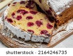 Small photo of dough cake with berries for dessert, cupcake sweet bread with cherries, Homemade sponge cake or chiffon cake on white table. Homemade bakery concept, top view