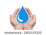 Water conservation and safe drinking water concept. Human hands holding blue water drop.