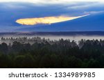 Dramatic Sunrise in the Mountains with Cloudy Sky and Misty Forest, Altai Mountains, East Kazakhstan. Fantasyland, Blue Hour Concept